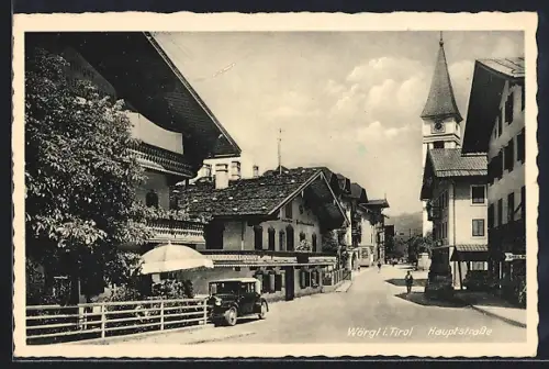 AK Wörgl, Hauptstrasse mit Kirche und Auto
