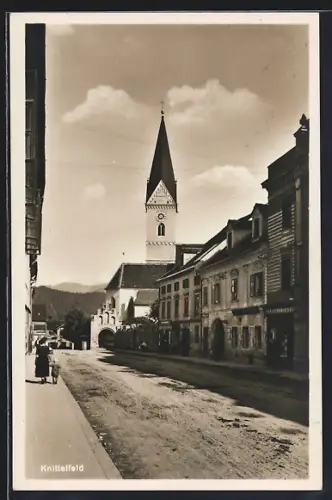 AK Knittelfeld, Strassenpartie mit Kirchturm