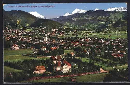 AK Garmisch-Partenkirchen, Ortsansicht mit dem Karwendelgebirge