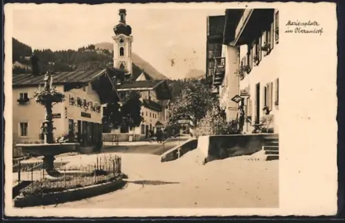 AK Oberaudorf, Marienplatz mit Brunnen, Geschäft und Kirche