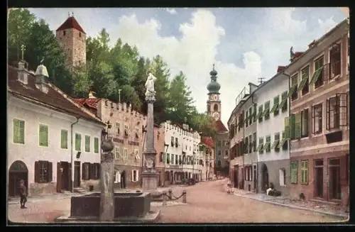 AK Bruneck, Strassenpartie mit Brunnen und Kirche