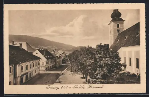 AK Irdning /Steiermark, Strassenpartie mit Kirche