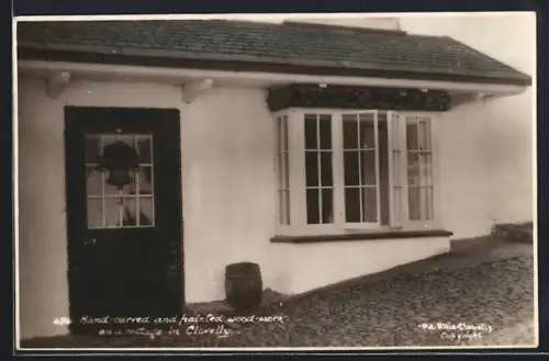 AK Clovelly, Hand-carved and painted woodwork on a cottage