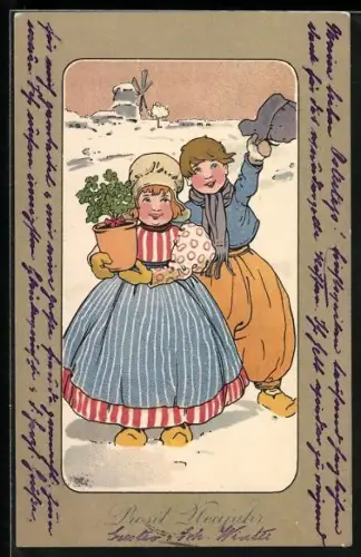 AK Zwei Kinder mit Kleeblättern im Schnee