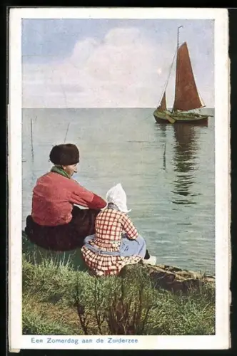 AK Mann und Kind in traditioneller niederländischer Kleidung sitzen am Ufer, Een Zomderdag aan de Zuiderzee