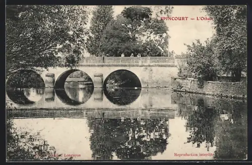 AK Spincourt, Pont sur l`Othain avec reflets dans l`eau et arbres environnants