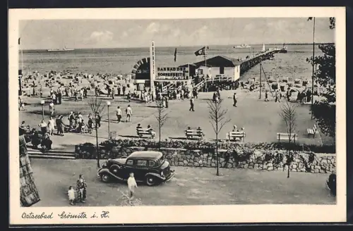 AK Grömitz i. H., Ostseebad, Strand mit Landungssteg und 