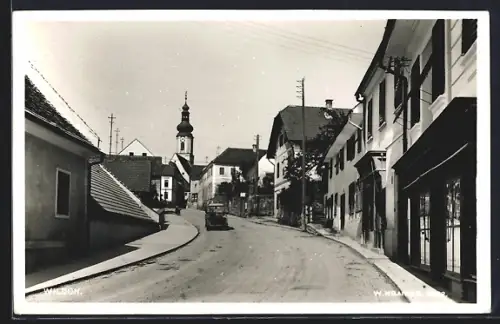 AK Wildon, Strassenpartie mit Blick zur Kirche