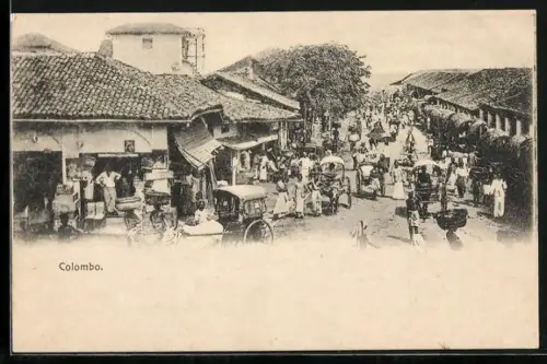 AK Colombo, Strassenpartie mit Geschäften und Rikschas