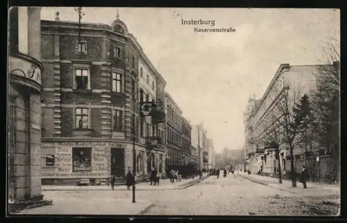 AK Insterburg, Kasernenstrasse mit Militär-Bedarfsartikel-Geschäft Emil Wetkus