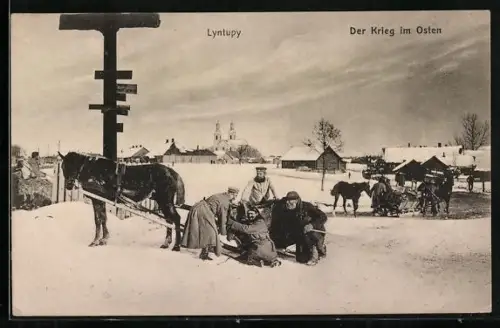 AK Lyntupy, Ortspartie mit Pferdeschlitten und Passanten
