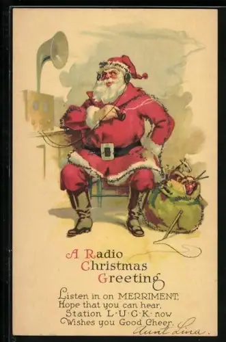 Künstler-AK Weihnachtsmann hält eines Ansprach im Radio