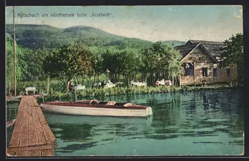 AK Pörtschach am Wörthersee, Gasthaus Inselwirt vom Wasser aus, Bootssteg mit Boot