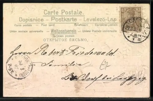 Präge-AK Osterhase im Schlitten mit Ostereiern, Veilchen und Kleeblätter