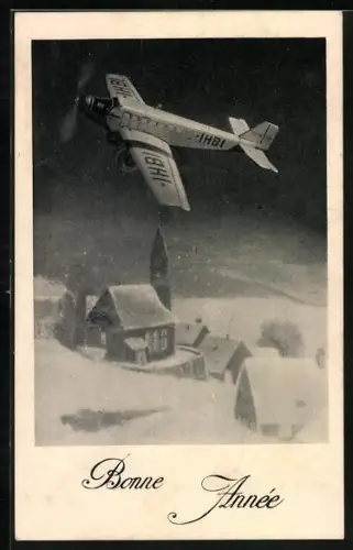 AK Flugzeug über verschneiter Landschaft