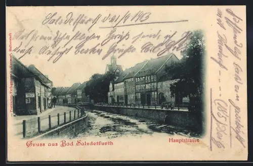 AK Bad Salzdetfurth, Hauptstrasse mit Gewässer und Brücke