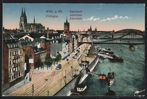 AK Köln, Leystapel, Rheinpromenade mit Brücken, Dom und Strassenbahn
