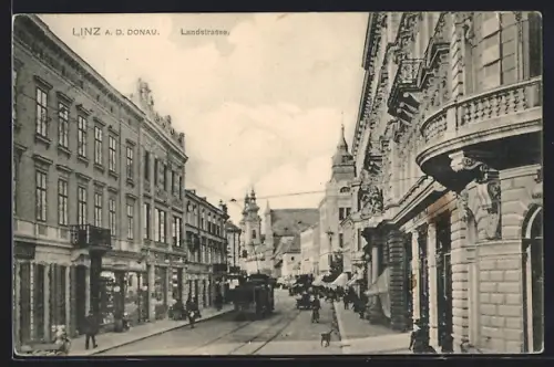 AK Linz a. d. Donau, Landstrasse mit Strassenbahn