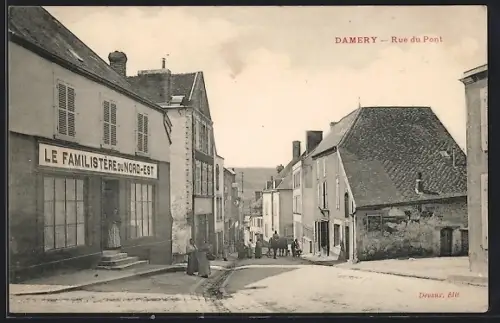 AK Damery, Rue du Pont avec le Familistère du Nord-Est et des passants