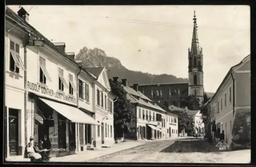 AK Admont, Geschäftsstrasse mit Blick zur Kirche