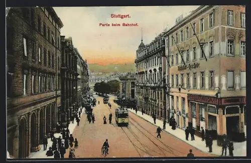 AK Stuttgart, Strassenpartie beim Bahnhof mit Geschäften und Strassenbahn