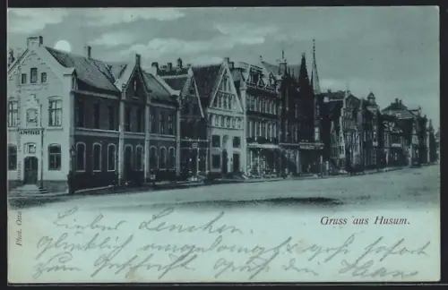 Mondschein-AK Husum / Nordsee, Grossstrasse mit Apotheke und Weinhandlung
