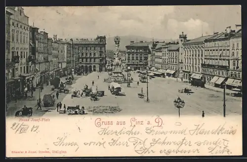 AK Linz a. D., Franz Josef-Platz mit Denkmal und Strassenbahn