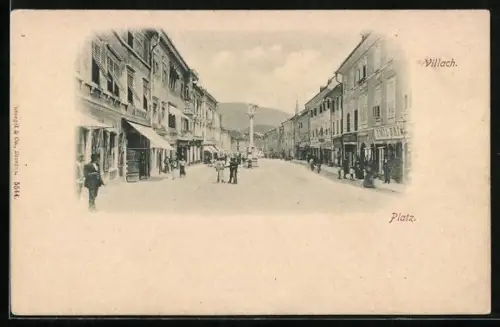 AK Villach, Platz mit Geschäften und Denkmal