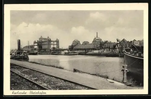 AK Karlsruhe i. B., Rheinhafen mit Bahnschienen und Blick auf Gebäude