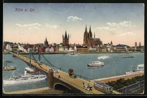 AK Köln a. Rh., Stadtpanorama vom Rheinufer aus mit Brücke und Dom