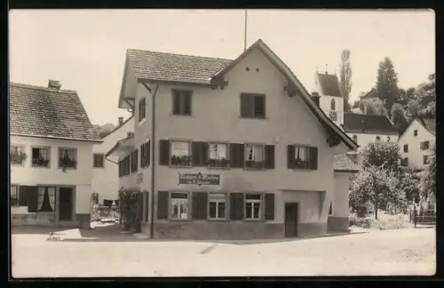 Foto-AK Birmenstorf, Metzgerei von H. Schneider mit Kirche