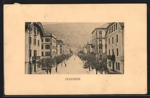 AK Fleurier, Strassenpartie mit Hotel-Pension B. de la Gare