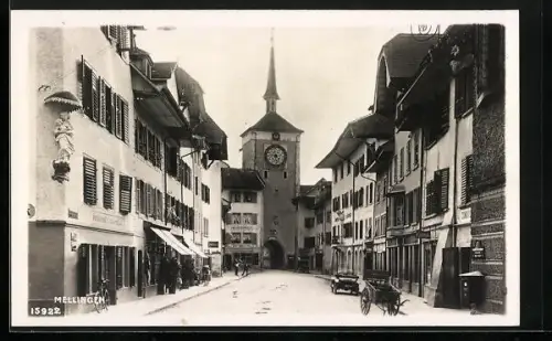 AK Mellingen, Strassenpartie mit Milchcentrale und Torturm