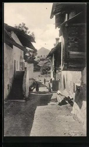 AK Münster /Graubünden, Strasse Dorfgasse