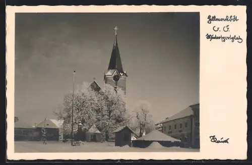 AK Hellmonsödt /O.-Ö., Ortspartie mit Kirche im Winter