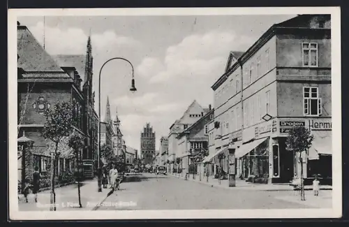 AK Demmin i. Pom., Strasse mit Drogerie