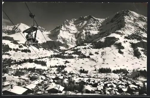 AK Adelboden, Sesselbahn zum Schwandfelsspitz über dem Ort, Winter