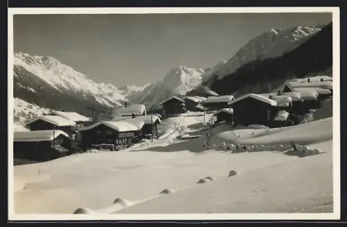 AK Klosters-Selfranga, Ortsansicht im Schnee mit Silvrettagruppe