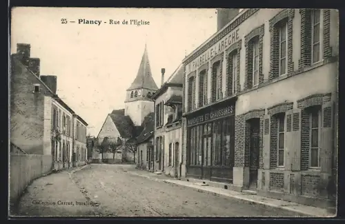 AK Plancy, Rue de l`Église avec vue sur l`église et magasins adjacents