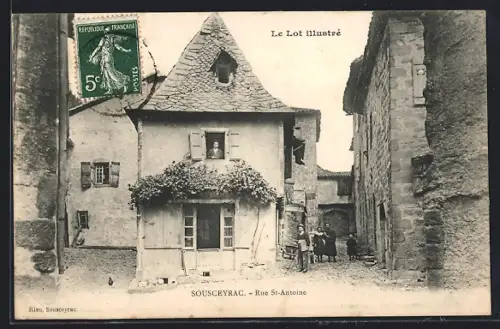 AK Sousceyrac, Rue St-Antoine avec maisons traditionnelles et habitants