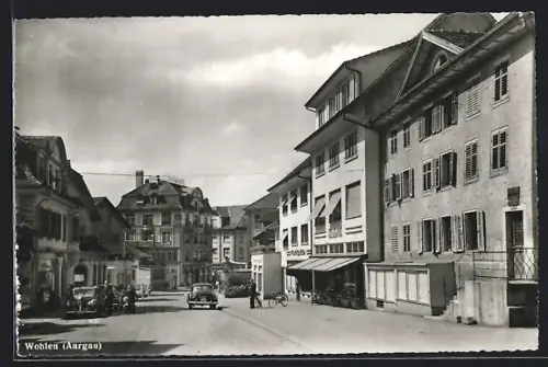 AK Wohlen /Aargau, Strassenpartie mit Geschäften im Sonnenschein