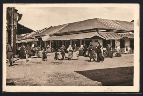 AK Kowel, Marktstrasse mit Marktbetrieb und Gebäude