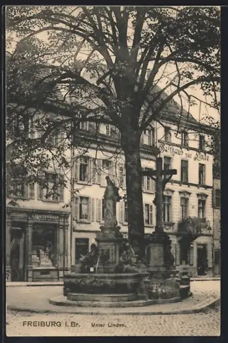 AK Freiburg i. Br., Unter Linden, Gasthaus zur Linde, Brunnen, Statue