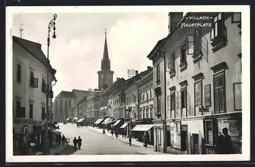 AK Villach, Hauptplatz mit Geschäften und Kirche