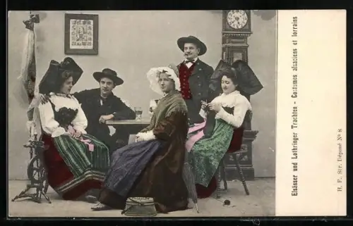 AK Elsässer und Lothringer Trachten, Männer und Frauen am Tisch