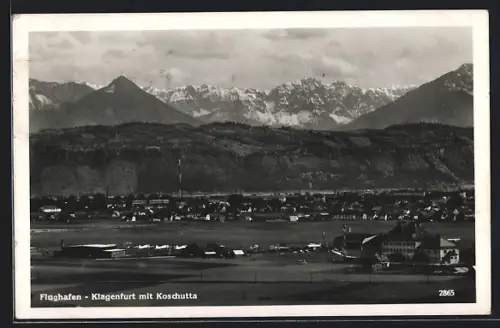 AK Klagenfurt, Flughafen mit dem Ort und Koschutta im Hintergrund
