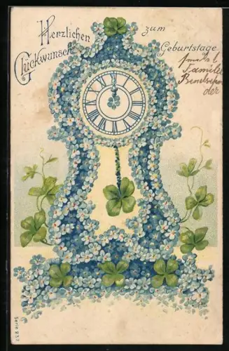 AK Standuhr aus Blüten gefertigt mit vierblättrigem Kleeblatt als Uhrenpendel