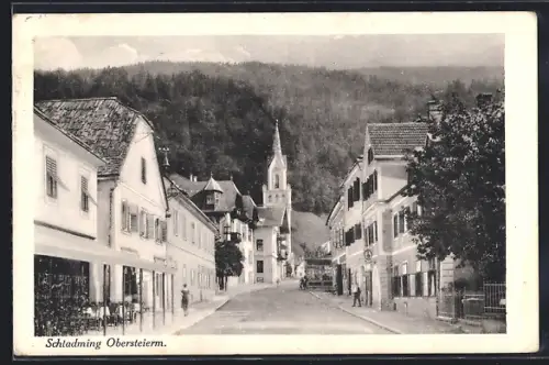 AK Schladming, Strassenpartie mit Blick zur Kirche