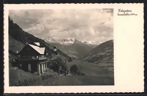 AK Hofgastein, Haus auf Pfeilern am Berghang