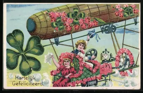 Künstler-AK Glückwunschkarte mit einem verzierten Zeppelin